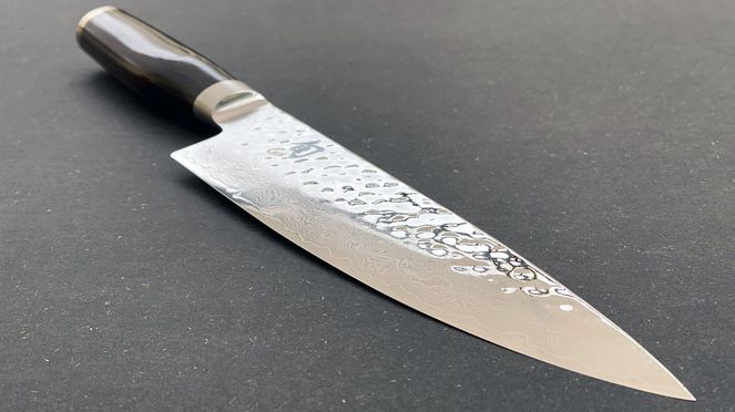 
                    Kai Chef's knife with blade refined by a hammer stroke surface