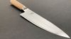 
                    Shun White Chef's Knife with blade in damask steel