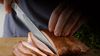 
                    Slicing knife cutting roast
