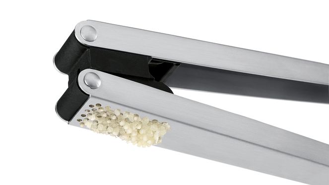 
                    Garlic press in stainless steel and plastic with sharp special blades